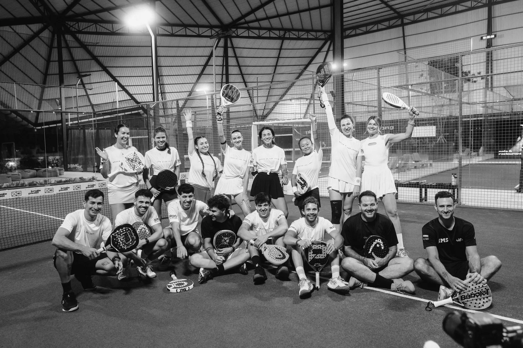 A large group of players together on court